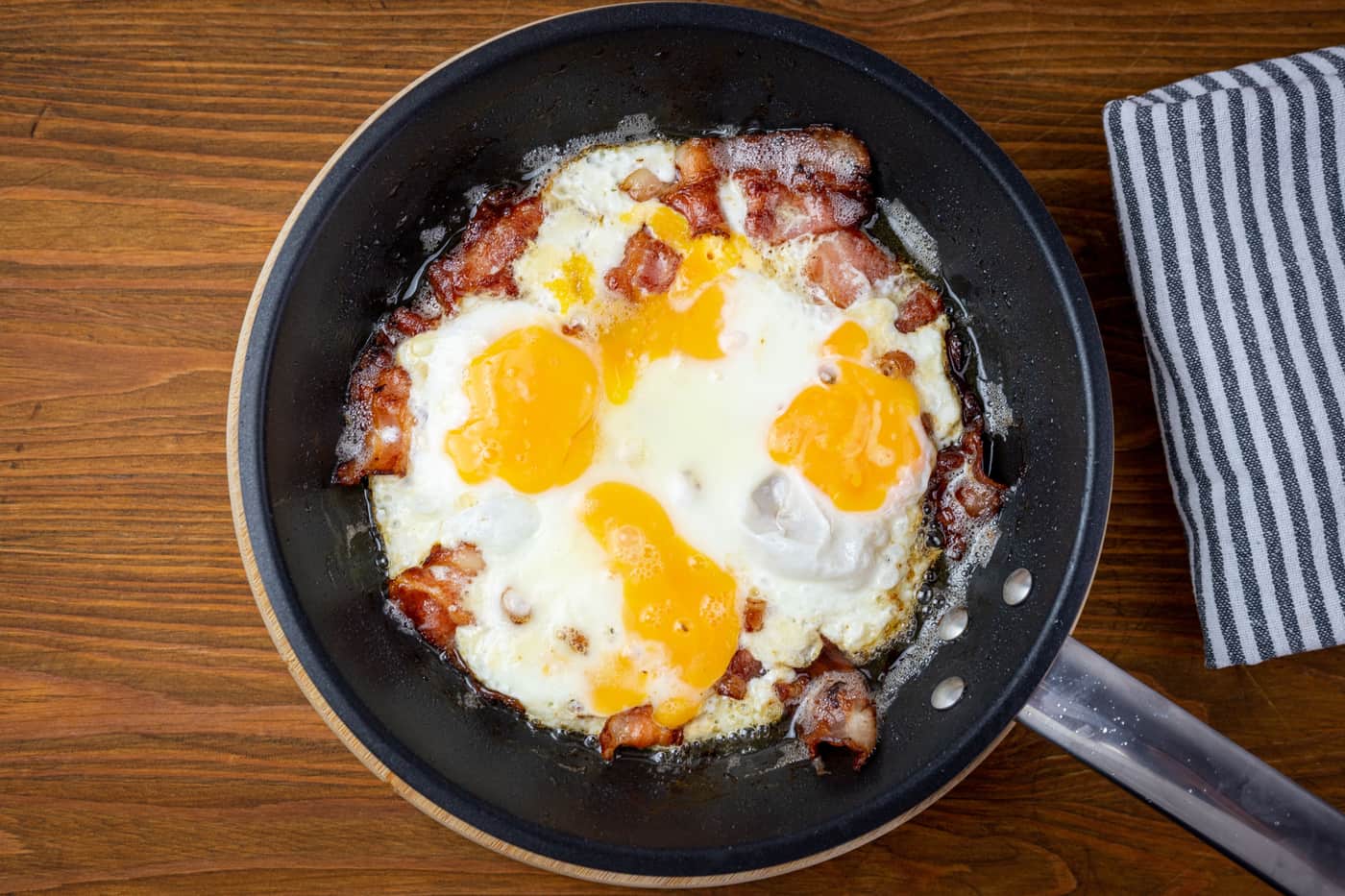 Frying pan photographed from directly above on a plain surface